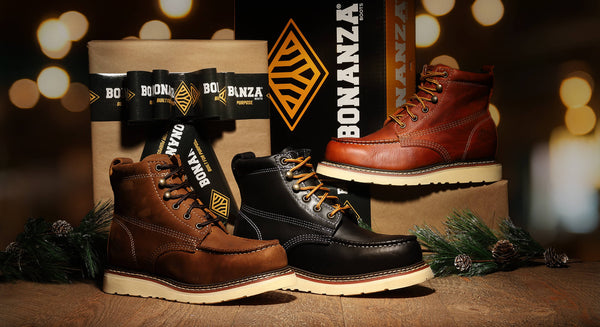 Three pairs of boots with 'Bonanza' branding on a wooden surface with blurred lights in the background.